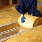 Construction,Worker,Thermally,Insulating,House,Attic,With,Glass,Wool