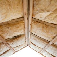 Insulation,Of,Attic,With,Fiberglass,Cold,Barrier,And,Insulation,Material