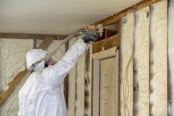 Worker,Spraying,Closed,Cell,Spray,Foam,Insulation,On,A,Home