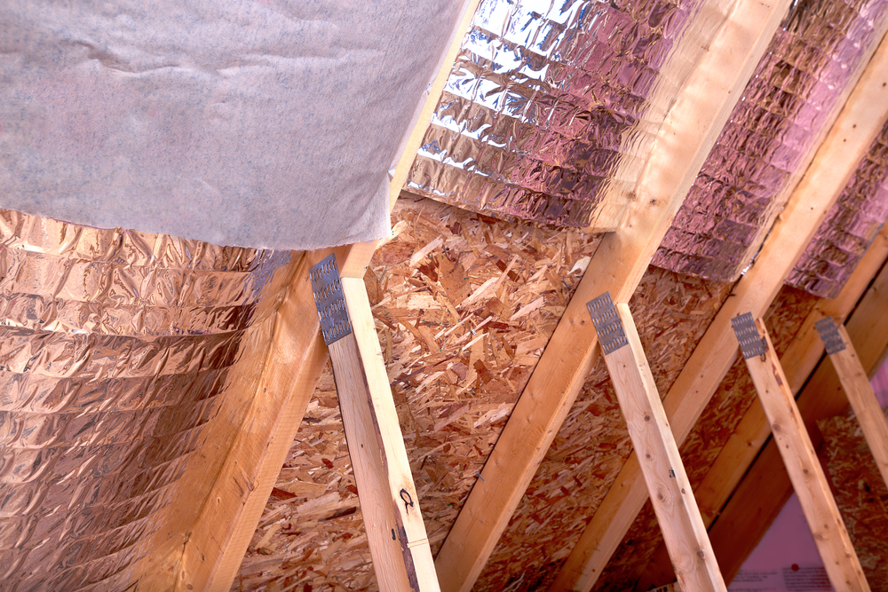 Inside,gable,and,joist,view,of,ongoing,project,,insulation,of